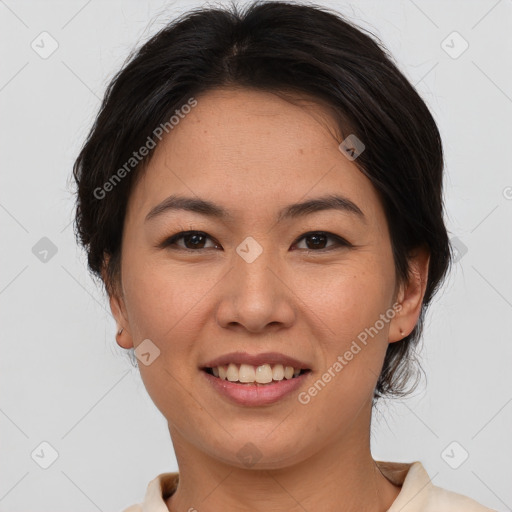 Joyful asian young-adult female with short  brown hair and brown eyes