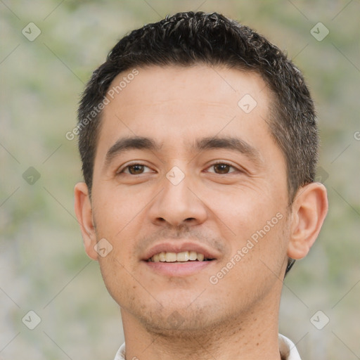 Joyful white young-adult male with short  black hair and brown eyes