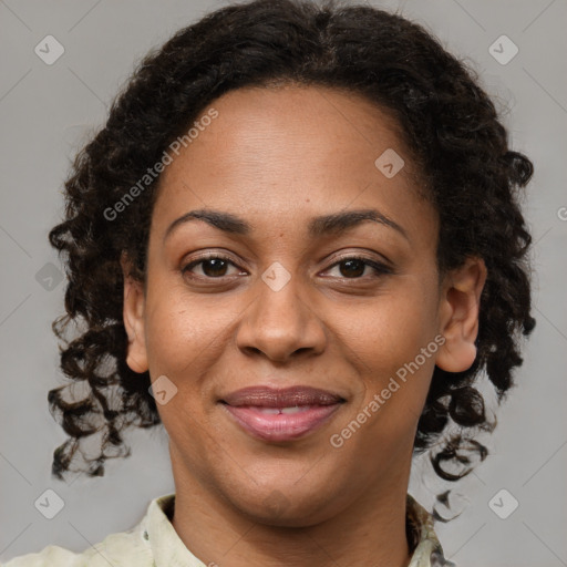 Joyful black adult female with medium  brown hair and brown eyes