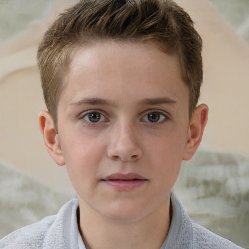 Joyful white child male with short  brown hair and grey eyes