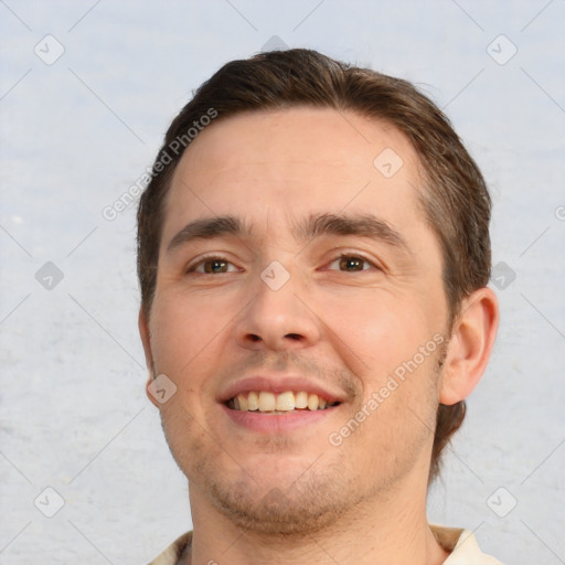 Joyful white young-adult male with short  brown hair and brown eyes