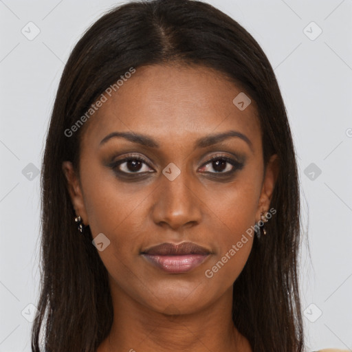 Joyful black young-adult female with long  brown hair and brown eyes