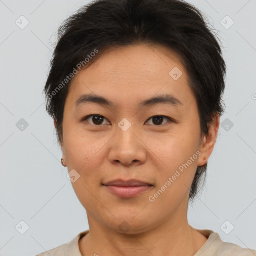 Joyful asian young-adult female with short  brown hair and brown eyes