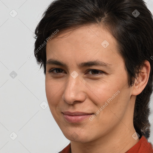 Joyful white young-adult female with medium  brown hair and brown eyes