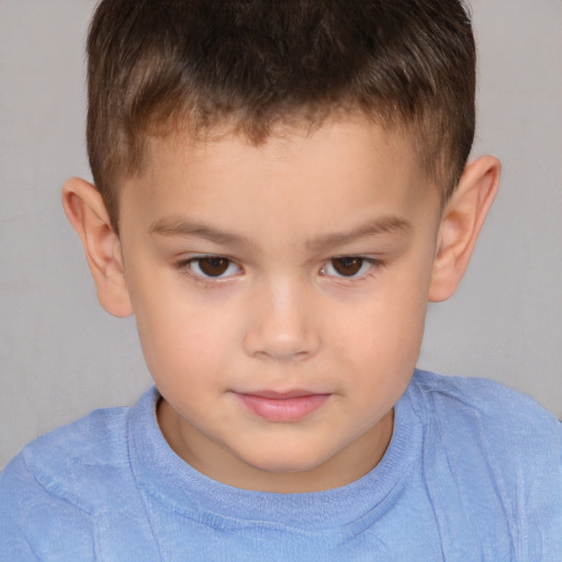 Joyful white child male with short  brown hair and brown eyes