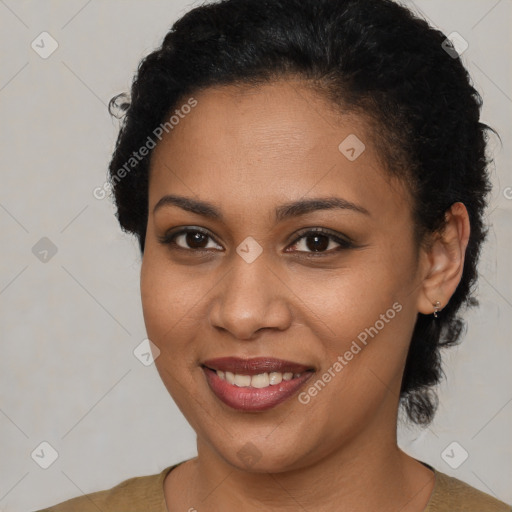 Joyful black young-adult female with short  brown hair and brown eyes