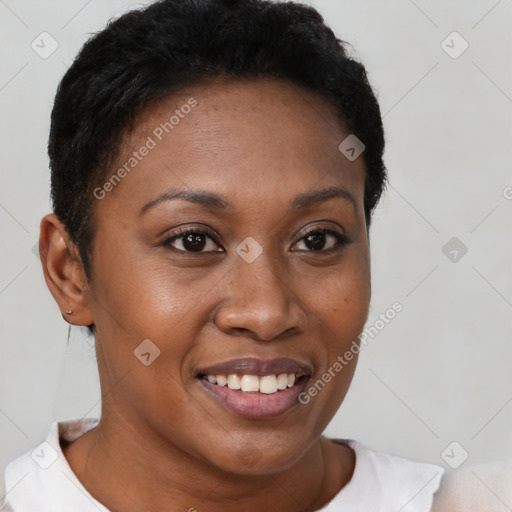 Joyful black young-adult female with short  brown hair and brown eyes