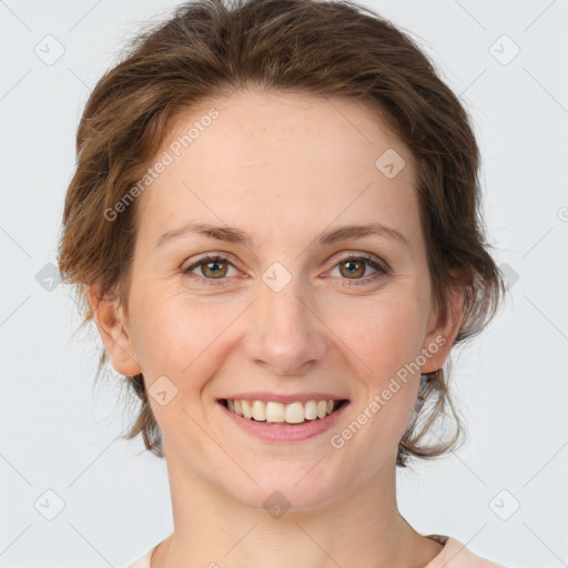 Joyful white young-adult female with medium  brown hair and green eyes