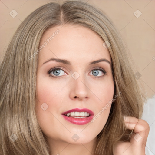 Joyful white young-adult female with long  brown hair and blue eyes