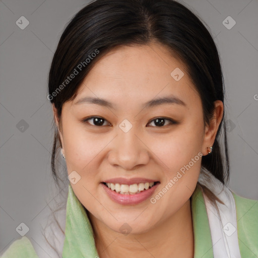 Joyful asian young-adult female with medium  brown hair and brown eyes