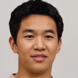 Joyful asian young-adult male with short  black hair and brown eyes