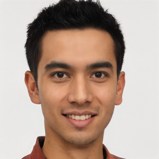 Joyful latino young-adult male with short  brown hair and brown eyes