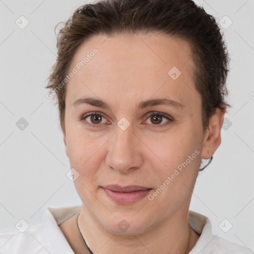 Joyful white adult female with short  brown hair and brown eyes