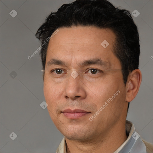 Joyful white adult male with short  black hair and brown eyes