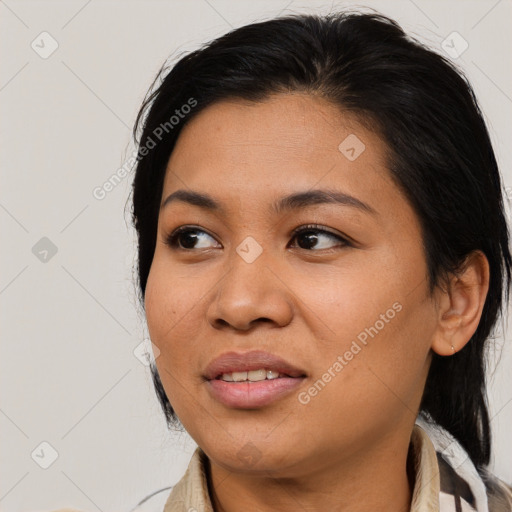 Joyful asian young-adult female with medium  black hair and brown eyes