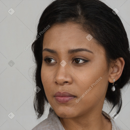 Neutral black young-adult female with long  brown hair and brown eyes