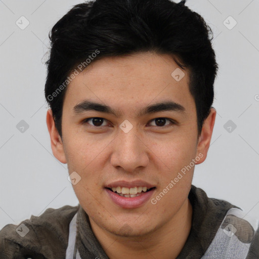 Joyful asian young-adult male with short  brown hair and brown eyes