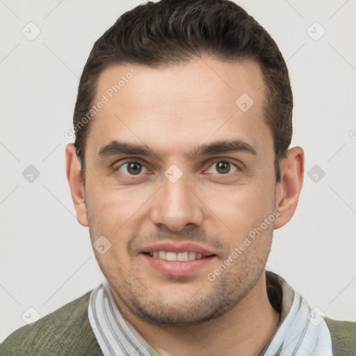 Joyful white young-adult male with short  brown hair and brown eyes