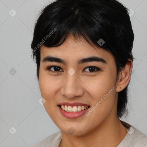 Joyful asian young-adult female with medium  brown hair and brown eyes