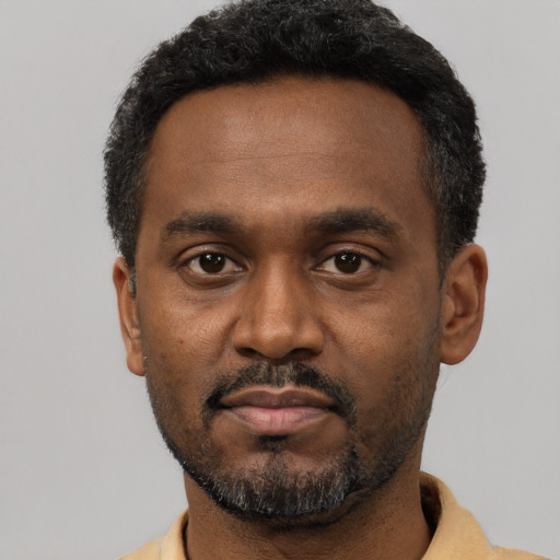 Neutral black young-adult male with short  black hair and brown eyes
