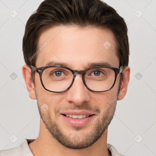 Joyful white young-adult male with short  brown hair and grey eyes