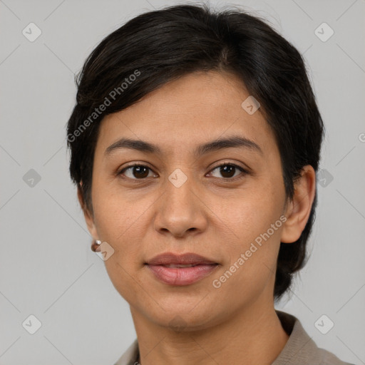 Joyful asian adult female with medium  brown hair and brown eyes