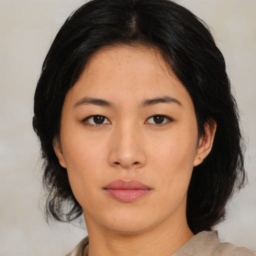 Neutral asian young-adult female with medium  black hair and brown eyes