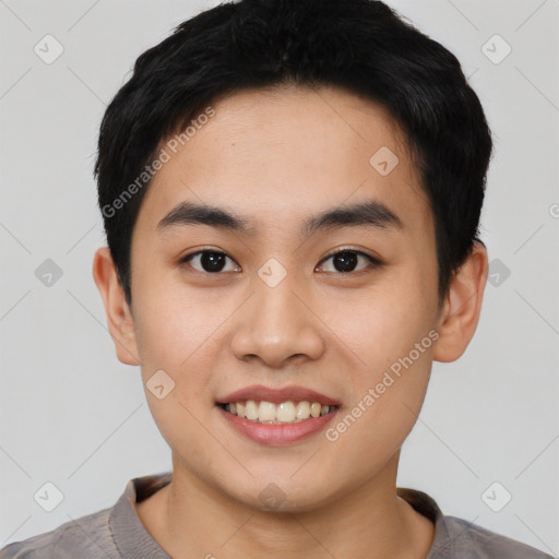 Joyful asian young-adult male with short  black hair and brown eyes