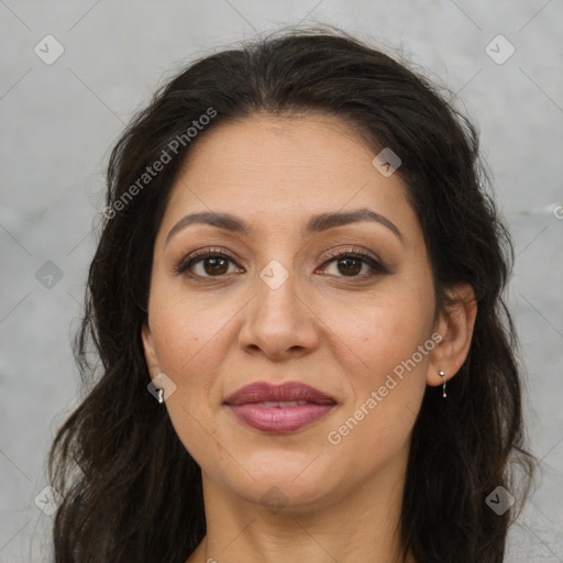 Joyful white adult female with long  brown hair and brown eyes