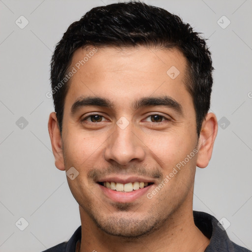 Joyful white young-adult male with short  black hair and brown eyes