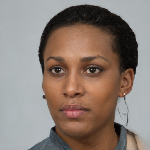 Neutral black young-adult female with short  black hair and brown eyes
