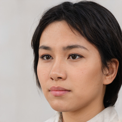 Neutral asian young-adult female with medium  black hair and brown eyes
