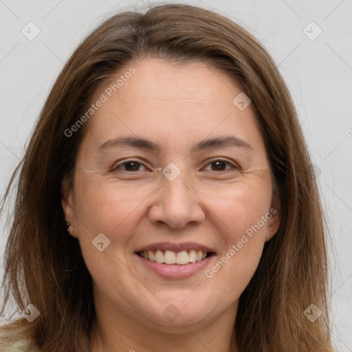 Joyful white adult female with long  brown hair and brown eyes