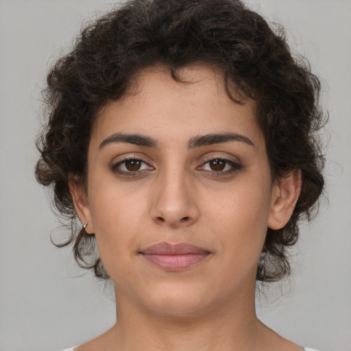 Joyful white young-adult female with medium  brown hair and brown eyes