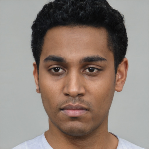Neutral black young-adult male with short  black hair and brown eyes