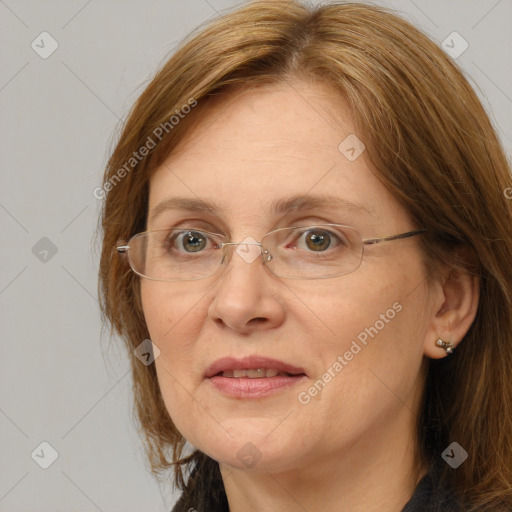 Joyful white adult female with long  brown hair and brown eyes