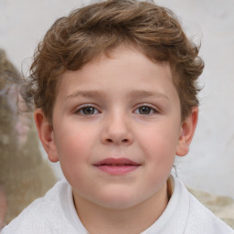 Joyful white child male with short  brown hair and brown eyes