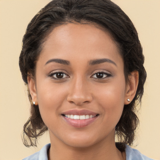 Joyful white young-adult female with medium  brown hair and brown eyes