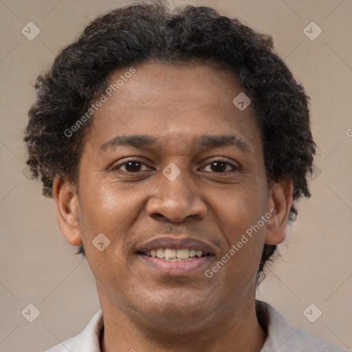 Joyful latino adult male with short  brown hair and brown eyes