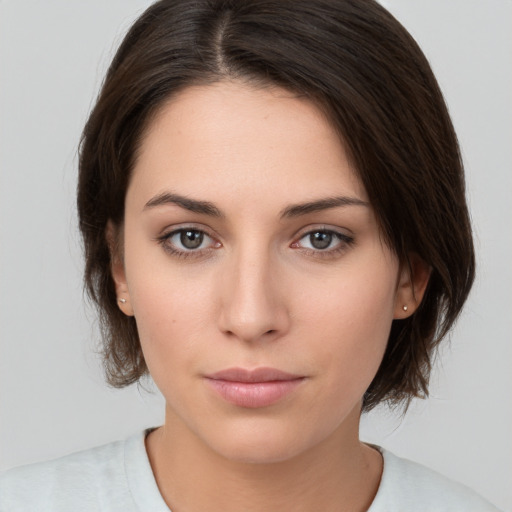 Neutral white young-adult female with medium  brown hair and brown eyes