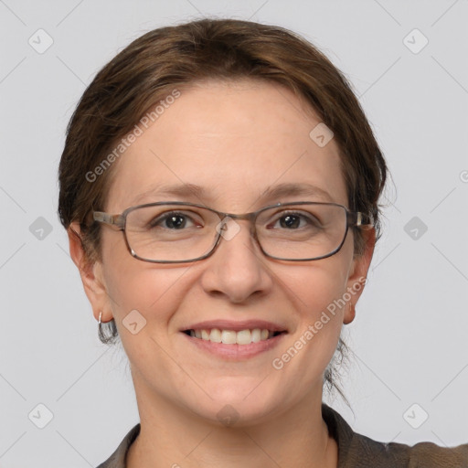 Joyful white adult female with short  brown hair and grey eyes