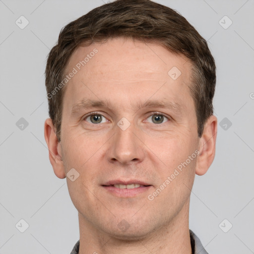 Joyful white adult male with short  brown hair and grey eyes