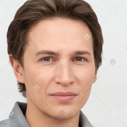 Joyful white adult male with short  brown hair and grey eyes