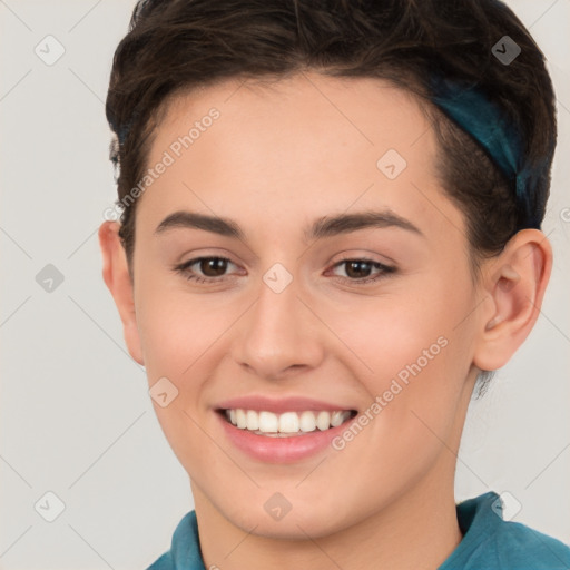 Joyful white young-adult female with short  brown hair and brown eyes