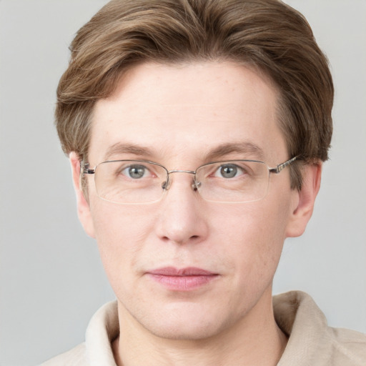 Joyful white adult male with short  brown hair and grey eyes