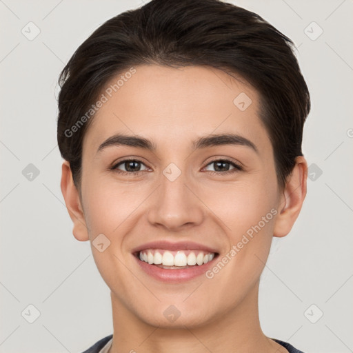 Joyful white young-adult female with short  brown hair and brown eyes