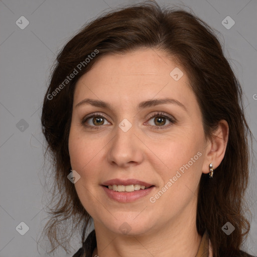 Joyful white adult female with medium  brown hair and brown eyes