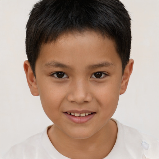 Joyful white child male with short  brown hair and brown eyes