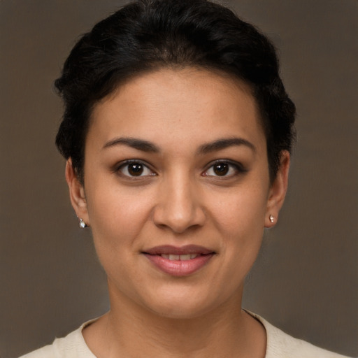 Joyful latino young-adult female with short  brown hair and brown eyes