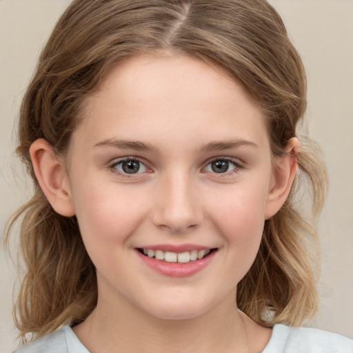 Joyful white child female with medium  brown hair and brown eyes